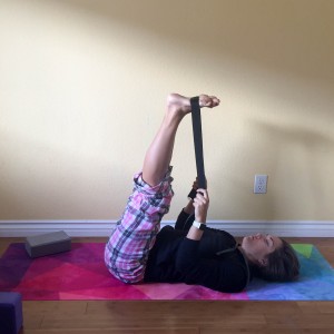 two leg raise with yoga strap
